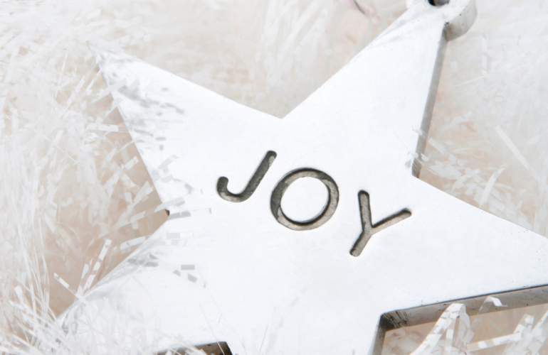 decorative word joy on a star shaped ornament